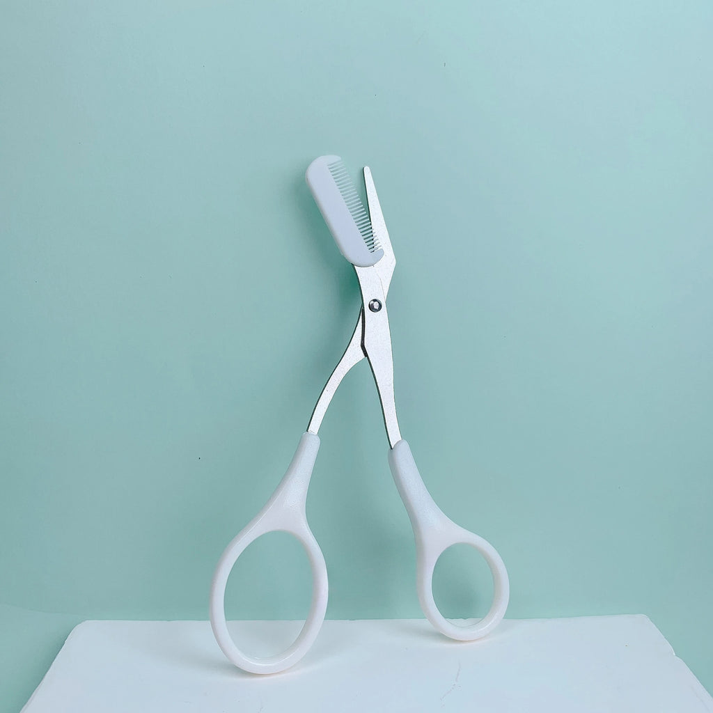 Pink eyebrow trimming scissors with built-in comb - stainless steel, precise grooming tool, creating perfect eyebrows